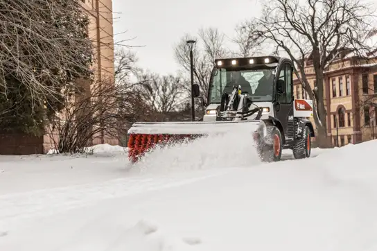 Bobcat UW56 with broom attachment