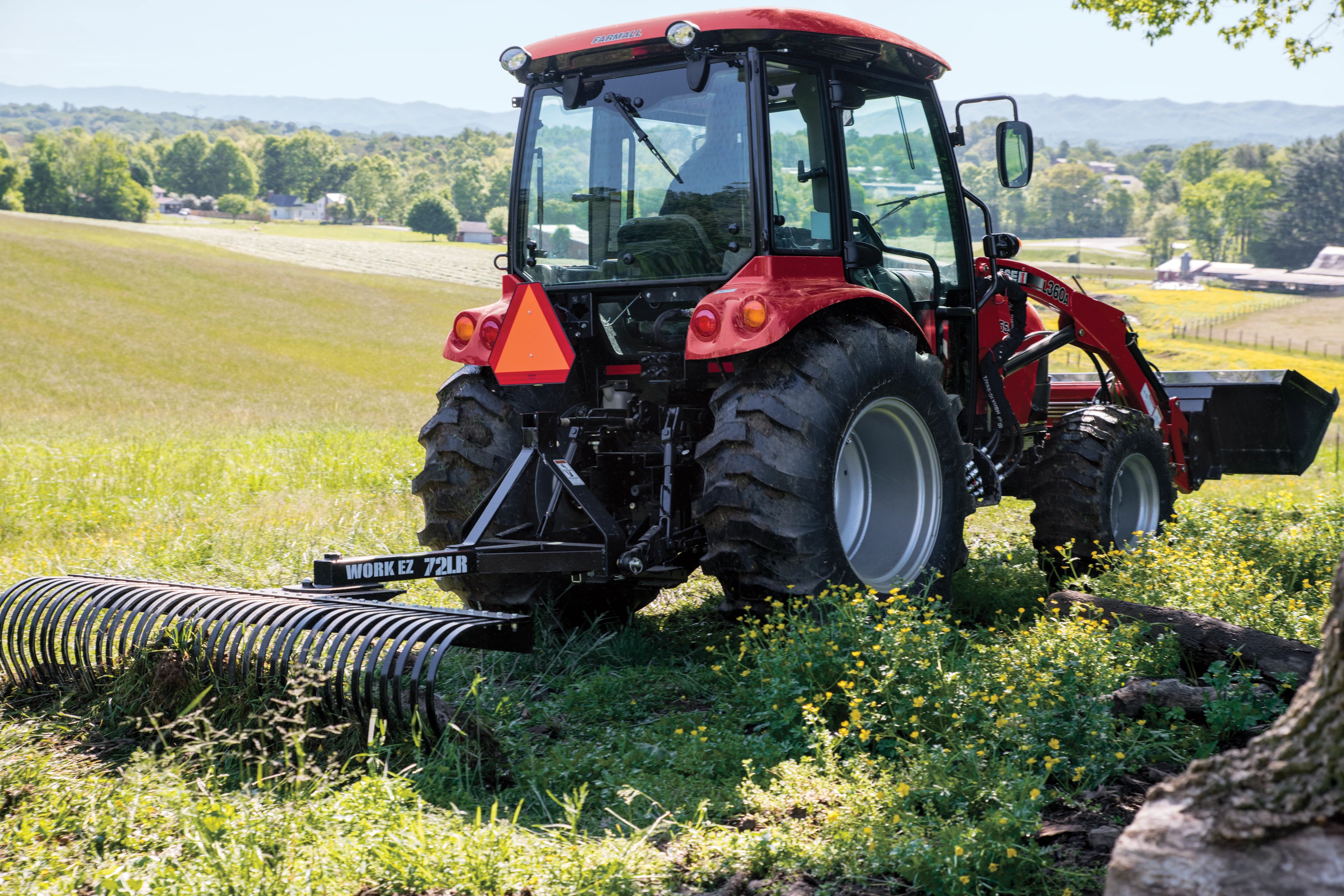 Case IH Compact 55C with rake attachment